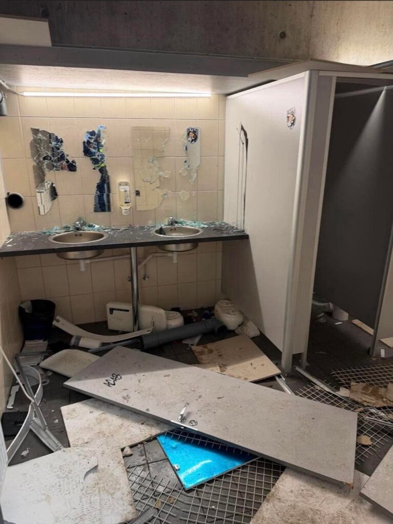 Vandalized bathroom stall at A. Le Coq Arena stadium in Tallinn